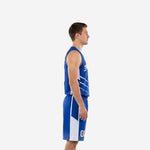 Custom royal blue basketball uniform front view showing arced team name front number and chevron side panel design on male model
