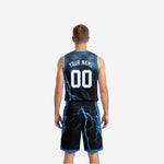 Side view of black and blue reversible basketball uniform showing armhole binding and side panel lightning detail