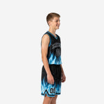 Custom boys basketball uniforms in black with electric-blue flame graphic on jersey and shorts, side view showing V-neck and chevron hem detail