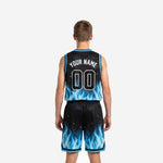 Youth travel basketball uniforms in black and blue flame design, right side view showing armhole binding and shorts drawcord waistband