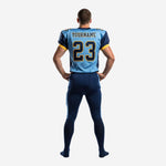 Back view of blue and gold football uniform showing back number placement and navy pant with light blue side stripe