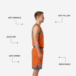Close-up detail of topographic contour line pattern sublimated across blue and orange reversible basketball jersey fabric