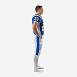 Side view of royal blue custom American football team uniform showing white jersey side panel and blue pant stripe running full leg length