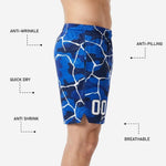 Close detail of sublimated white crackle and camo pattern on blue basketball shorts showing colorfast print quality
