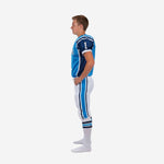 Right side view of custom blue and white youth American football uniform with V-neck collar, set-in sleeves, and game-length white pants with sublimated side stripe
