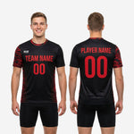 Flat lay of bold black custom mens soccer training jersey with red camo print and full sublimation finish