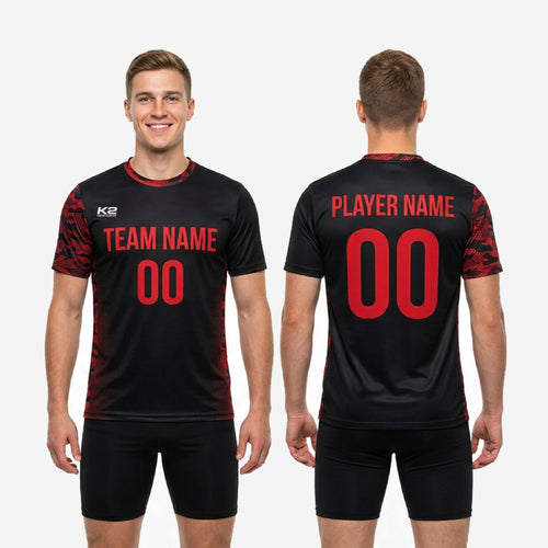 Flat lay of bold black custom mens soccer training jersey with red camo print and full sublimation finish