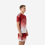 Custom red soccer uniform gradient Dark Red to White, side view showing three white shoulder stripes and shorts stripe detail
