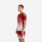 Red soccer uniform set with Dark Red to White gradient sublimation, second side view showing V-neck collar trim and sleeve cuffs