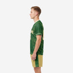 Custom green soccer uniform right side view displaying full botanical fern sublimation pattern on jersey and matching shorts