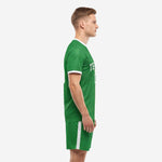 Kelly Green men's soccer uniform set side view showing white sleeve cuffs and matching green shorts with white side stripe