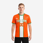 Bold orange soccer jersey with white center panel and Kelly Green trim, front view on male model