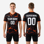Detail shot of Athletic Orange lava-crack full print sublimation on black custom soccer training jersey for club and school teams