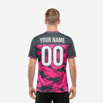 Back view of bold hot pink and charcoal custom printed soccer jersey showing player name and number zones