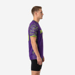 Side view of bold purple mens soccer training jersey showing hex-dot camo sleeve print and neon green side panel detail