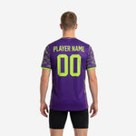 Close detail of neon green hex-dot camo print on sleeve of purple custom soccer training jersey with neon green cuff band