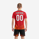 Bold red and black soccer uniforms back view showing YOUR NAME and number 00 on fire gradient jersey with black ember shorts