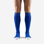 Bold royal blue custom soccer socks front view showing diamond cuff band and white toe panel on adult male player
