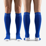 Bold royal blue custom soccer socks over the calf fit on adult male legs showing full shin guard coverage length