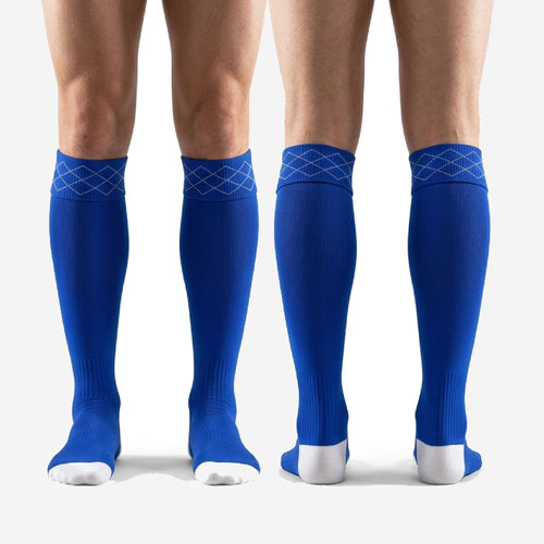 Bold royal blue custom soccer socks over the calf fit on adult male legs showing full shin guard coverage length