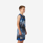 Front view of grey and royal blue custom boys basketball uniforms with arched team name and lightning bolt sublimation print