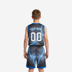Right side view of custom boys basketball uniform showing V-neck blue trim and matching lightning print jersey and shorts