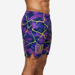 Front view of men's custom basketball shorts in all-over purple camo pattern with neon yellow crackle overlay and bold team number on lower thigh