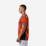 Right side view of orange and navy bulk football jersey showing shoulder panel detail and sleeve TV number placement