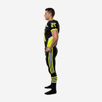 Side view of sublimated American football uniform in black with neon yellow diagonal jersey panel and full-length pant stripe with white accent