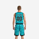 Side view of the teal and black reversible side of the basketball uniform set showing black waistband and contrast trim details