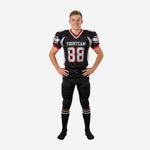 Bulk youth football uniforms in black with silver shoulder panels and red trim, showing front number 88 and team name across chest