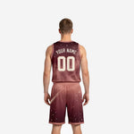 Close side view of sublimated burgundy basketball uniform showing rose armhole binding, comet tail graphic and star dot pattern across the shorts leg