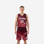 Custom burgundy basketball uniforms full set with galaxy constellation print, silver comet graphic, arched team name and front number on maroon jersey and matching shorts