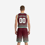 Opposite side view of sublimated burgundy basketball uniform set with mint contrast binding at armhole, waistband, and shorts hem on geometric diamond design