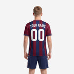 Close-up detail of custom sublimated soccer jersey in burgundy and navy blue stripes
