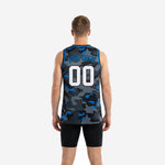 Opposite side view of sublimated camo basketball jersey in charcoal and royal blue showing full-body camo pattern coverage