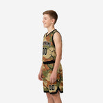 Side view of boys basketball uniforms showing tan and olive camo pattern and black bound armholes on youth model