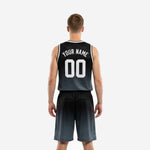 Opposite side view of custom charcoal basketball uniform set showing gradient fade detail from black to dark charcoal on jersey and shorts