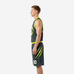 Side view of charcoal and neon green basketball uniform showing claw-mark graphic on jersey and matching shorts leg detail