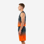 Side view of charcoal and orange gradient basketball uniform showing V-neck jersey and athletic-cut shorts with elastic waistband
