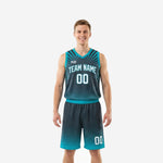Charcoal basketball uniforms with teal V-neck binding and starburst front panel, full set front and back view showing team name and player numbers