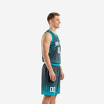 Custom charcoal and teal basketball uniform front view with arched team name, white front number, and halftone dot fade on the jersey and shorts