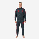 Men's custom red and black soccer tracksuit in charcoal with crimson geometric stripe, front view showing chest number and team logo print zones