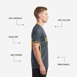 Close side angle of men's charcoal soccer team jersey highlighting geometric sublimation pattern and gold side stripe