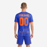 Close detail of sublimated city grid print on Royal Blue men's soccer jersey with Orange crew neck and cuff trim