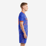 Custom men's soccer uniform set in Royal Blue and Orange city grid design, left side view showing jersey and shorts