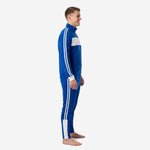 Left side view of custom Royal Blue soccer tracksuit showing twin white sleeve and pant leg stripes on adult male model