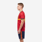 Custom red soccer uniform right side view showing sublimated geometric shoulder pattern and matching Navy Blue shorts stripe detail