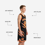 Detail of claw-slash sublimated print on black and orange youth basketball uniform jersey front panel