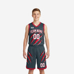 Grey youth basketball uniforms with red claw-slash graphic - charcoal jersey and matching shorts front view on youth boy model